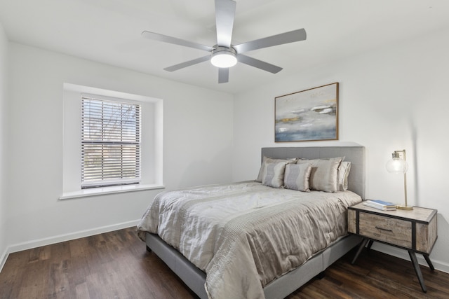 bedroom with dark hardwood / wood-style floors and ceiling fan