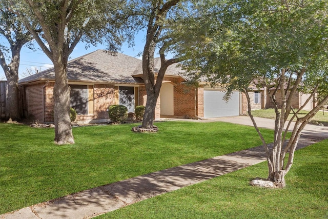 ranch-style home featuring a garage and a front lawn