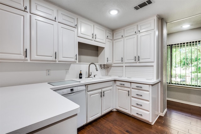 kitchen with white cabinetry, dark wood-type flooring, sink, and white dishwasher