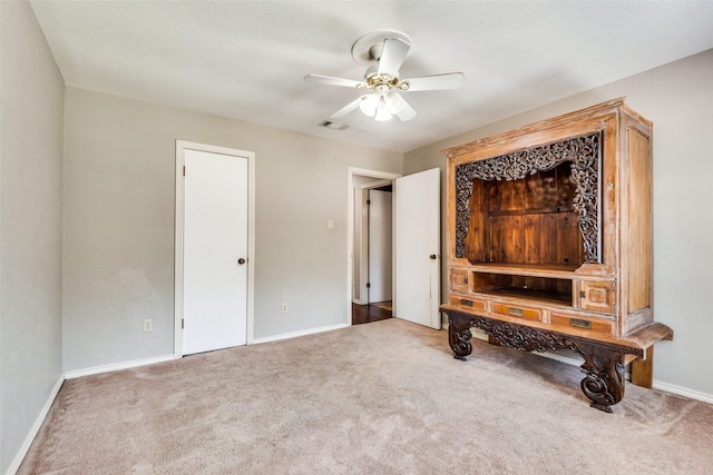 interior space featuring ceiling fan