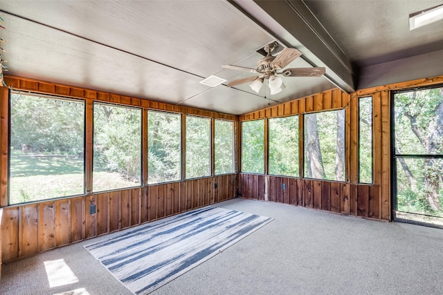 unfurnished sunroom with vaulted ceiling, plenty of natural light, and ceiling fan