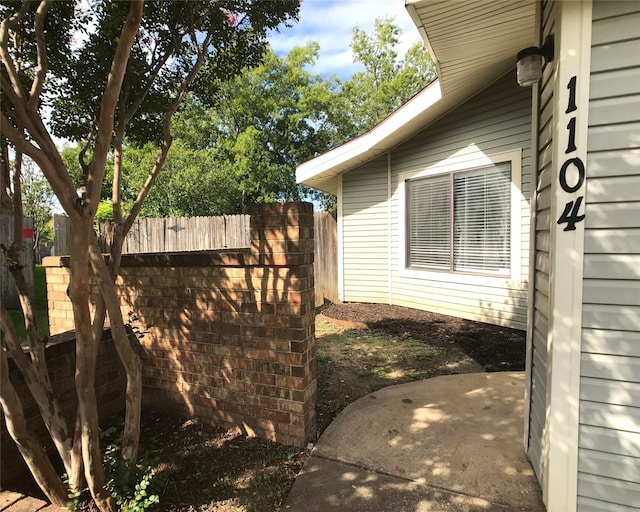 view of property exterior featuring a patio area