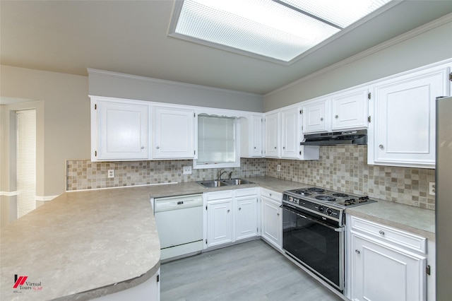 kitchen featuring white dishwasher, black electric range oven, sink, and white cabinets