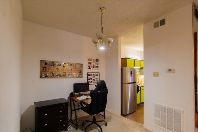 office with a notable chandelier and a textured ceiling