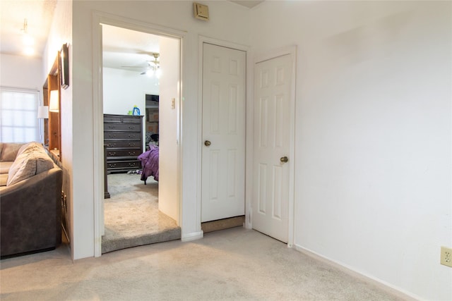 interior space featuring light colored carpet