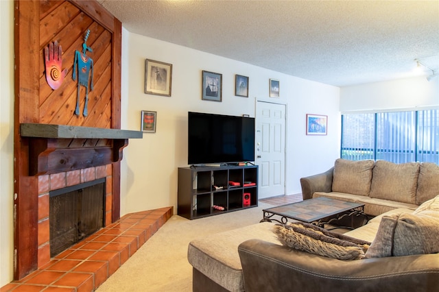 living room with carpet, a textured ceiling, and a tile fireplace