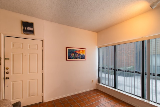 interior space with a textured ceiling