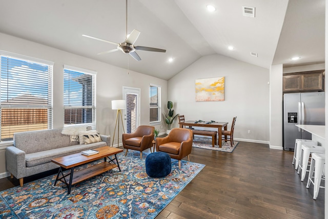 living room featuring ceiling fan, dark hardwood / wood-style flooring, and vaulted ceiling