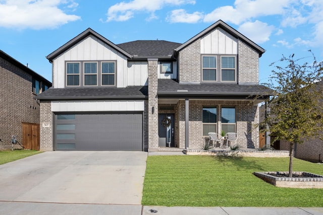 view of front of house featuring a porch, a garage, and a front yard