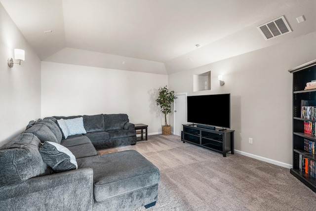 carpeted living room featuring lofted ceiling