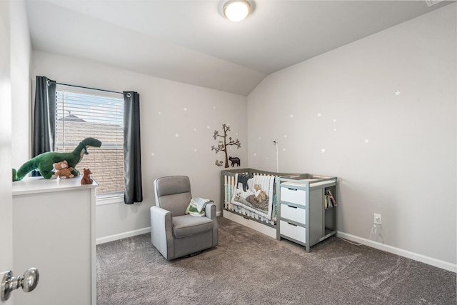 sitting room with carpet floors and vaulted ceiling