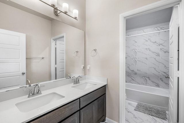 bathroom featuring vanity and tiled shower / bath combo