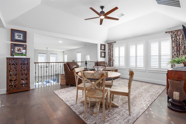 dining area with ceiling fan, dark wood-type flooring, and lofted ceiling