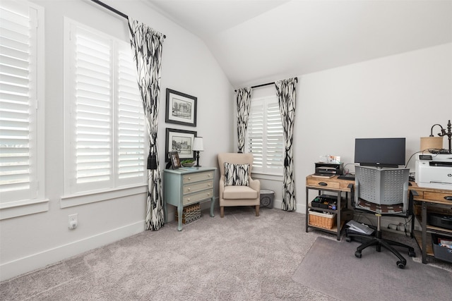 home office featuring carpet floors and vaulted ceiling