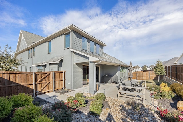 rear view of property with a patio area