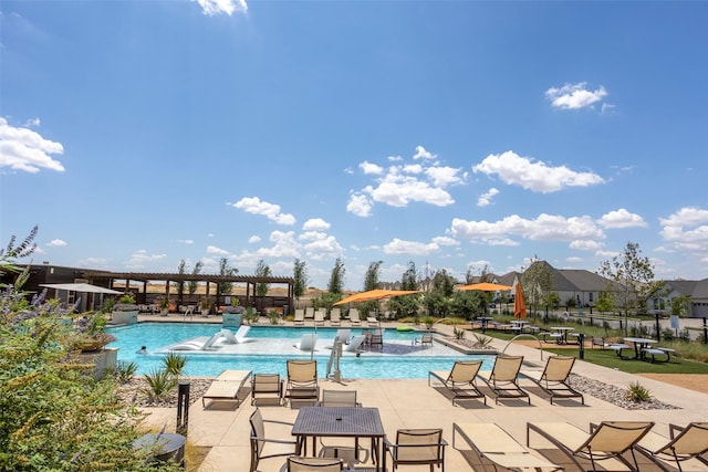 view of swimming pool with a patio