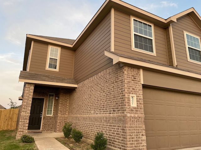 view of front of property featuring a garage