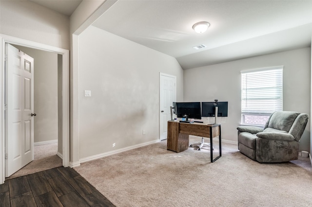 office featuring lofted ceiling and hardwood / wood-style floors