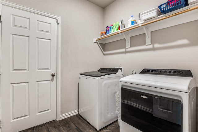 washroom featuring dark hardwood / wood-style flooring and washer and clothes dryer