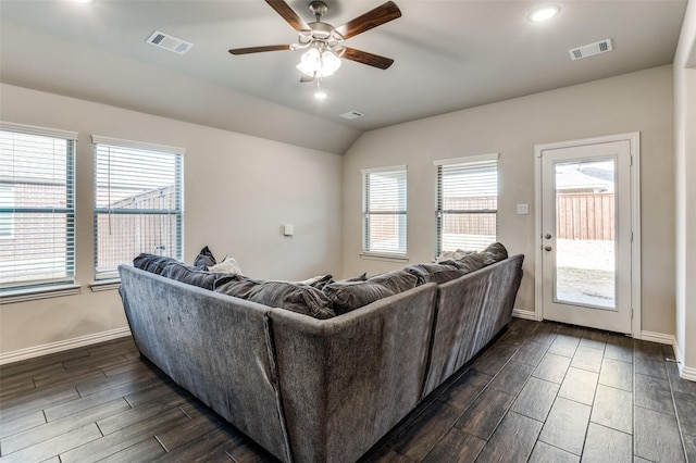 living room featuring vaulted ceiling and ceiling fan