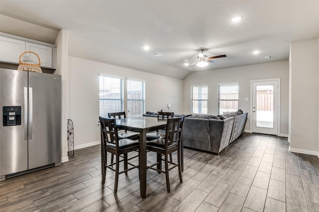 dining area featuring lofted ceiling and ceiling fan