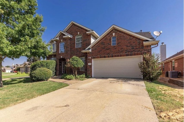 view of property with a front lawn and a garage