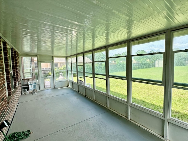 unfurnished sunroom featuring healthy amount of natural light