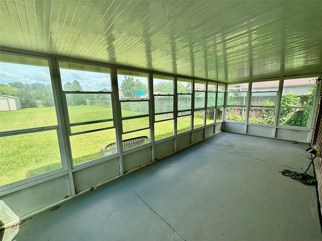 unfurnished sunroom with healthy amount of natural light