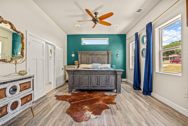 bedroom featuring light hardwood / wood-style flooring and ceiling fan