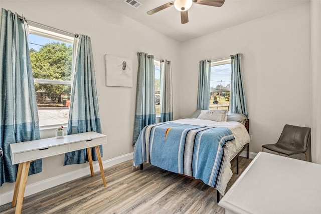 bedroom with ceiling fan and hardwood / wood-style flooring