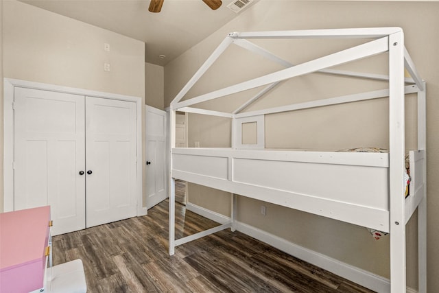 unfurnished bedroom featuring dark hardwood / wood-style flooring and ceiling fan