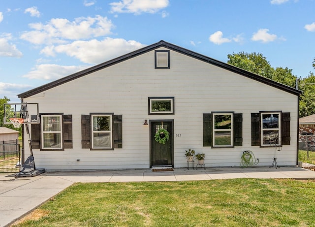 rear view of house with a lawn