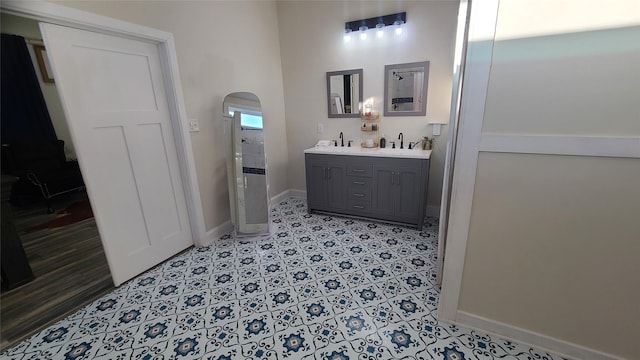 bathroom featuring vanity and a shower