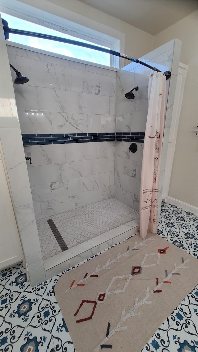 bathroom featuring tile patterned floors and a shower with curtain