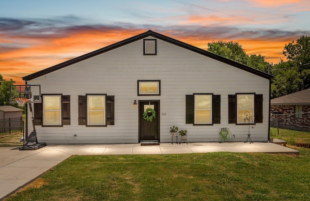 view of front of property with a lawn