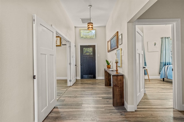 foyer entrance with dark hardwood / wood-style flooring