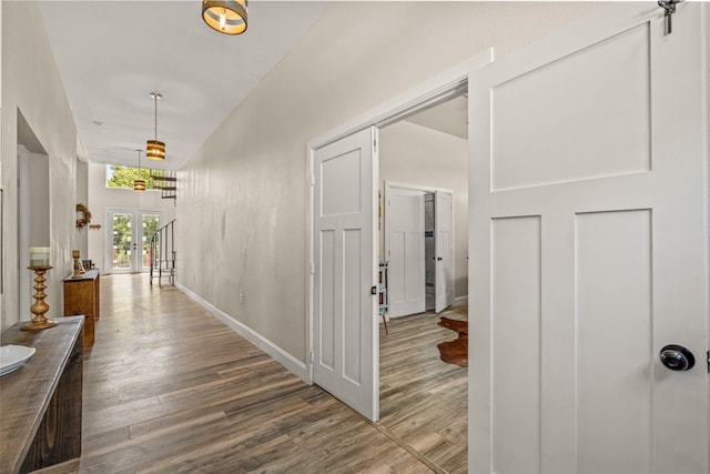 hallway featuring french doors and hardwood / wood-style floors