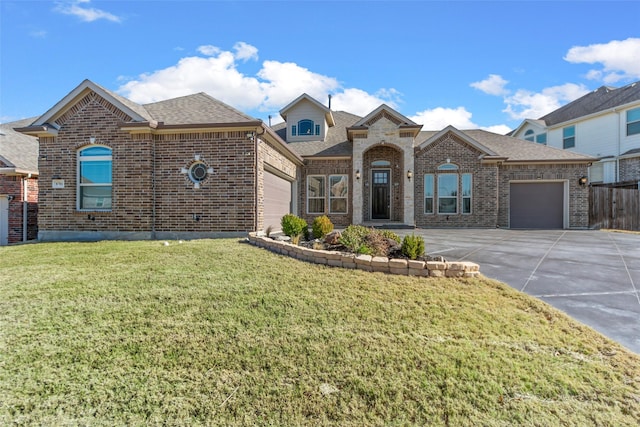 view of front of house with a front yard and a garage