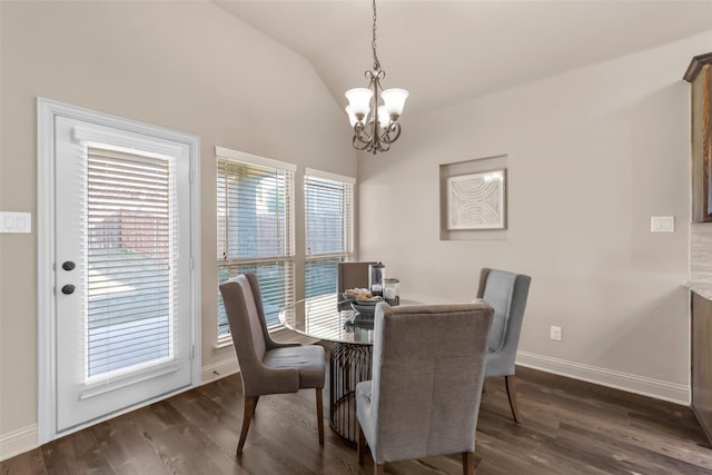 dining room featuring a notable chandelier, lofted ceiling, and dark hardwood / wood-style floors