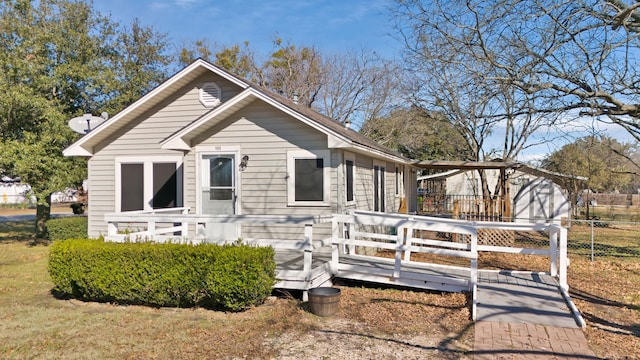 bungalow featuring a deck