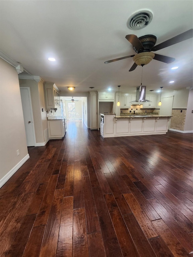 interior space featuring ceiling fan and dark hardwood / wood-style flooring