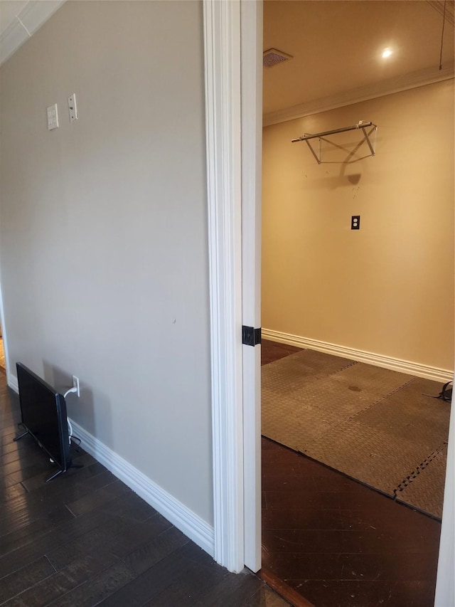 laundry area with dark hardwood / wood-style flooring