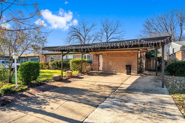 view of front of property featuring a carport