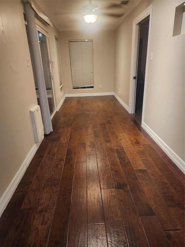 hall featuring radiator heating unit and dark wood-type flooring