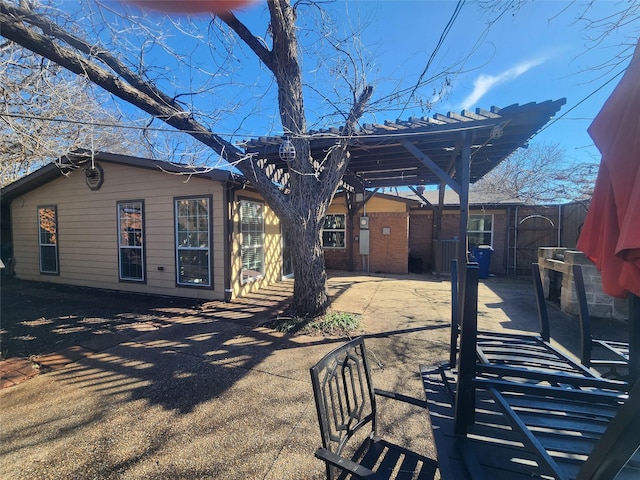 rear view of house with a pergola