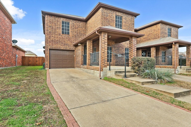 view of front property with covered porch, a garage, and a front lawn