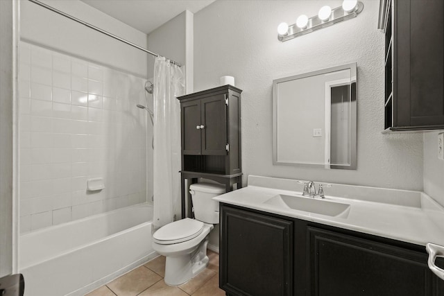 full bathroom with tile patterned floors, vanity, toilet, and shower / bath combo with shower curtain