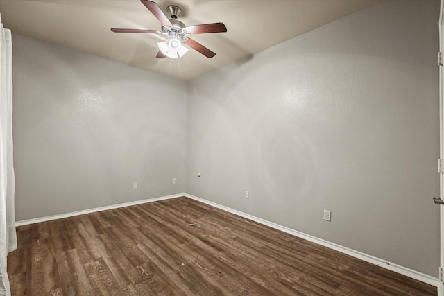 unfurnished room with ceiling fan and dark hardwood / wood-style flooring