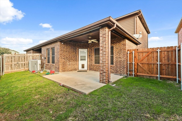 back of property featuring a lawn, ceiling fan, a patio, and central AC unit