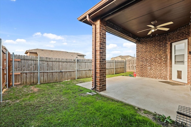 view of yard featuring ceiling fan and a patio area